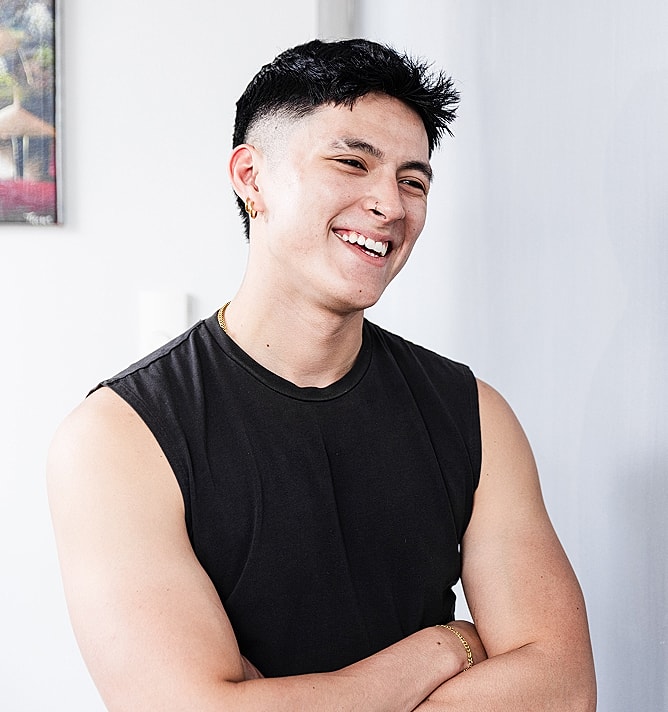Smiling young man with short dark hair.