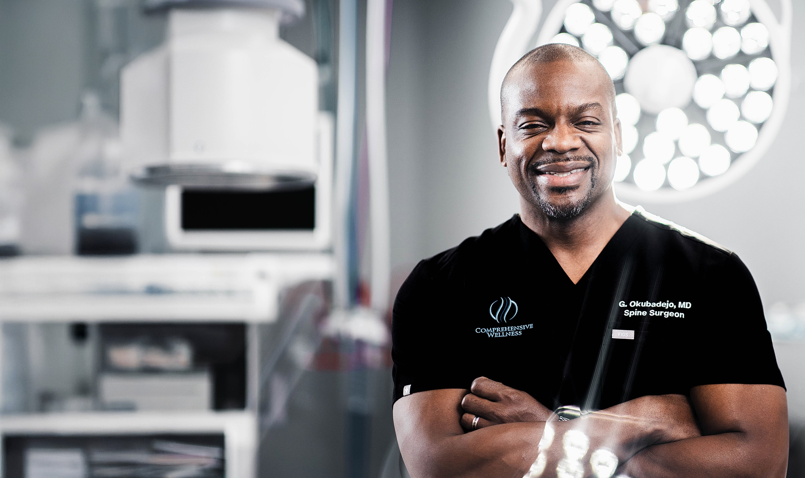 Smiling surgeon in operating room setting.
