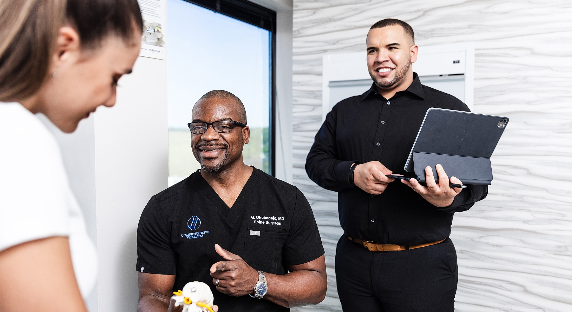 nyc spine surgeon discussing sciatica treatment options with a patient.