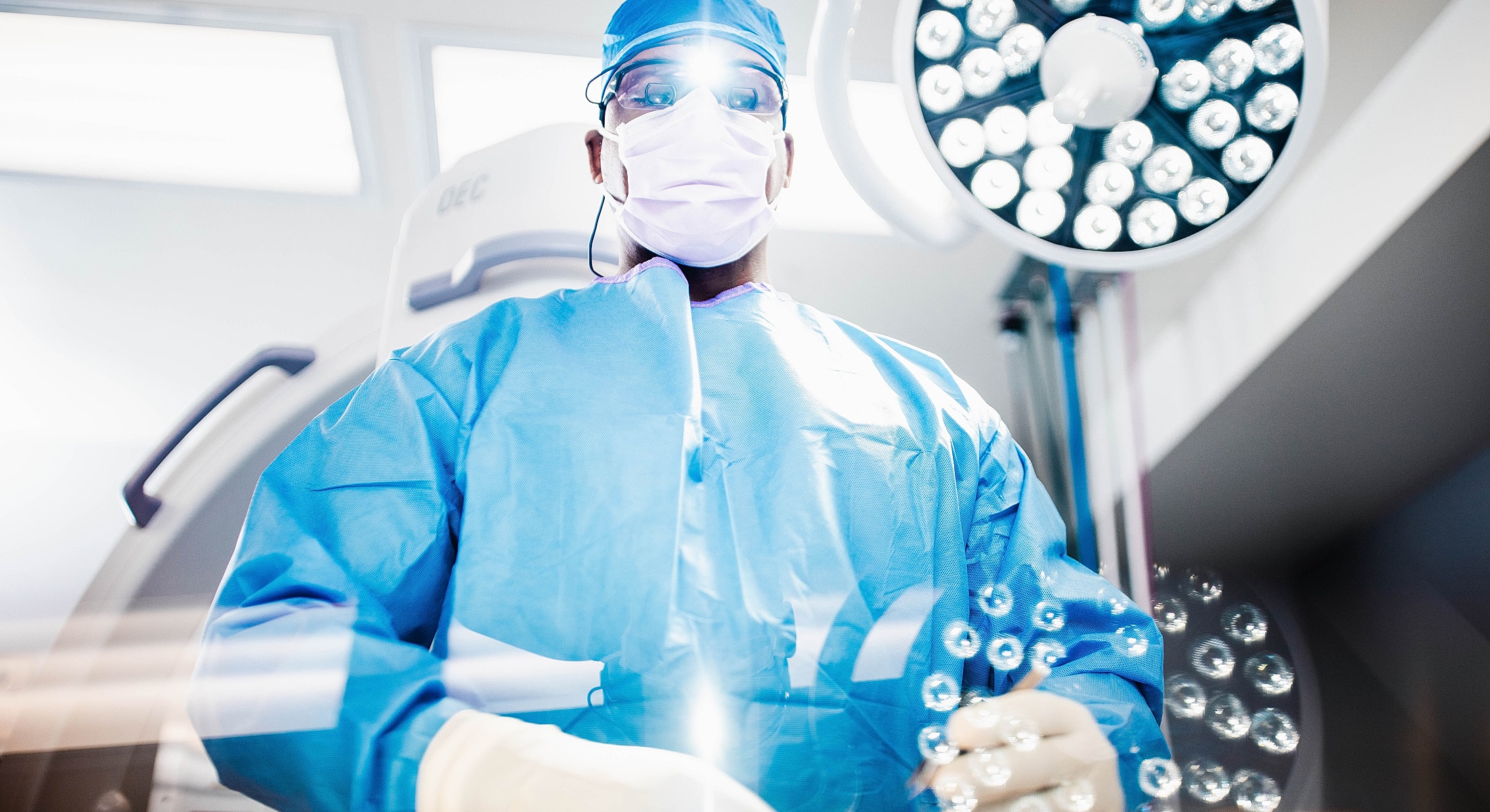 Spine surgeon preparing for spinal fusion surgery in operating room.